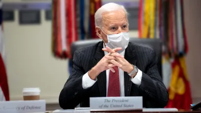 An image of President Joe Biden at a meeting in the White House while wearing a mask in February 2021.